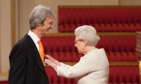 Andrew receives OBE from the Queen