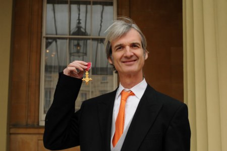 Andrew holds his OBE