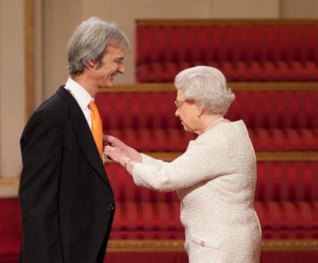 The Queen presents Andrew with his OBE